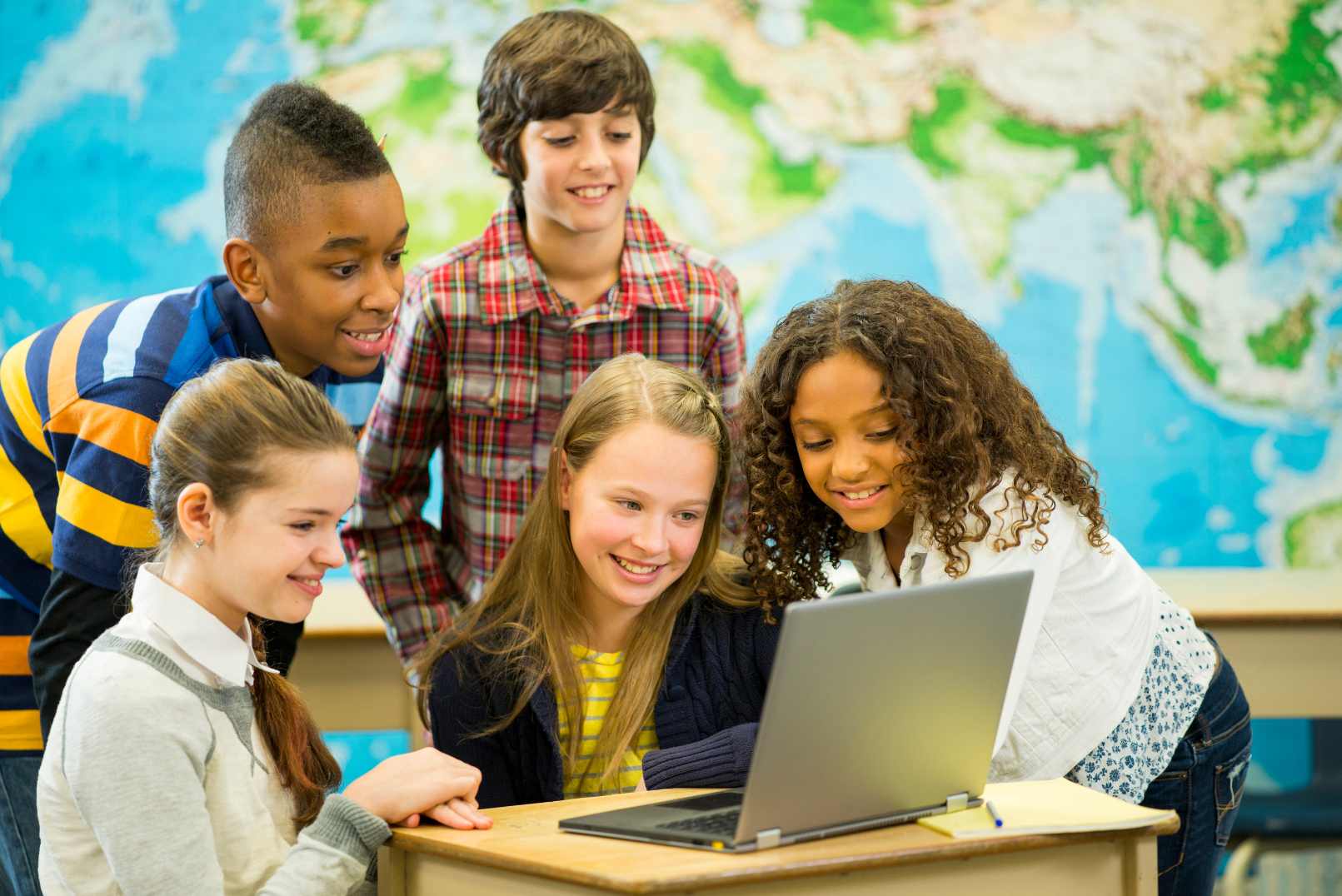 Students looking on a laptop