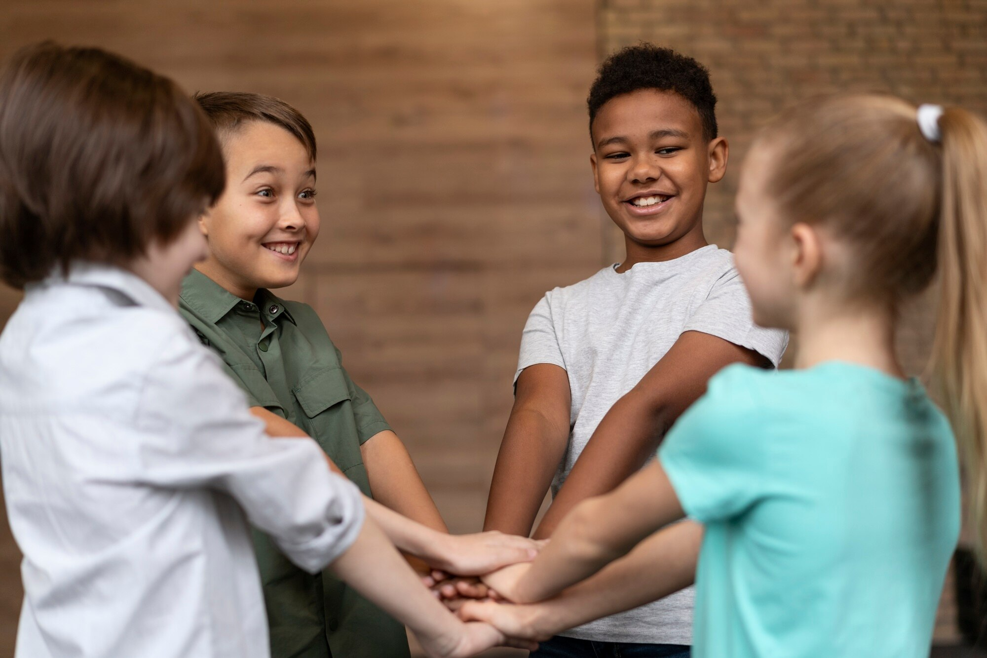 Children collaborating and holding hands