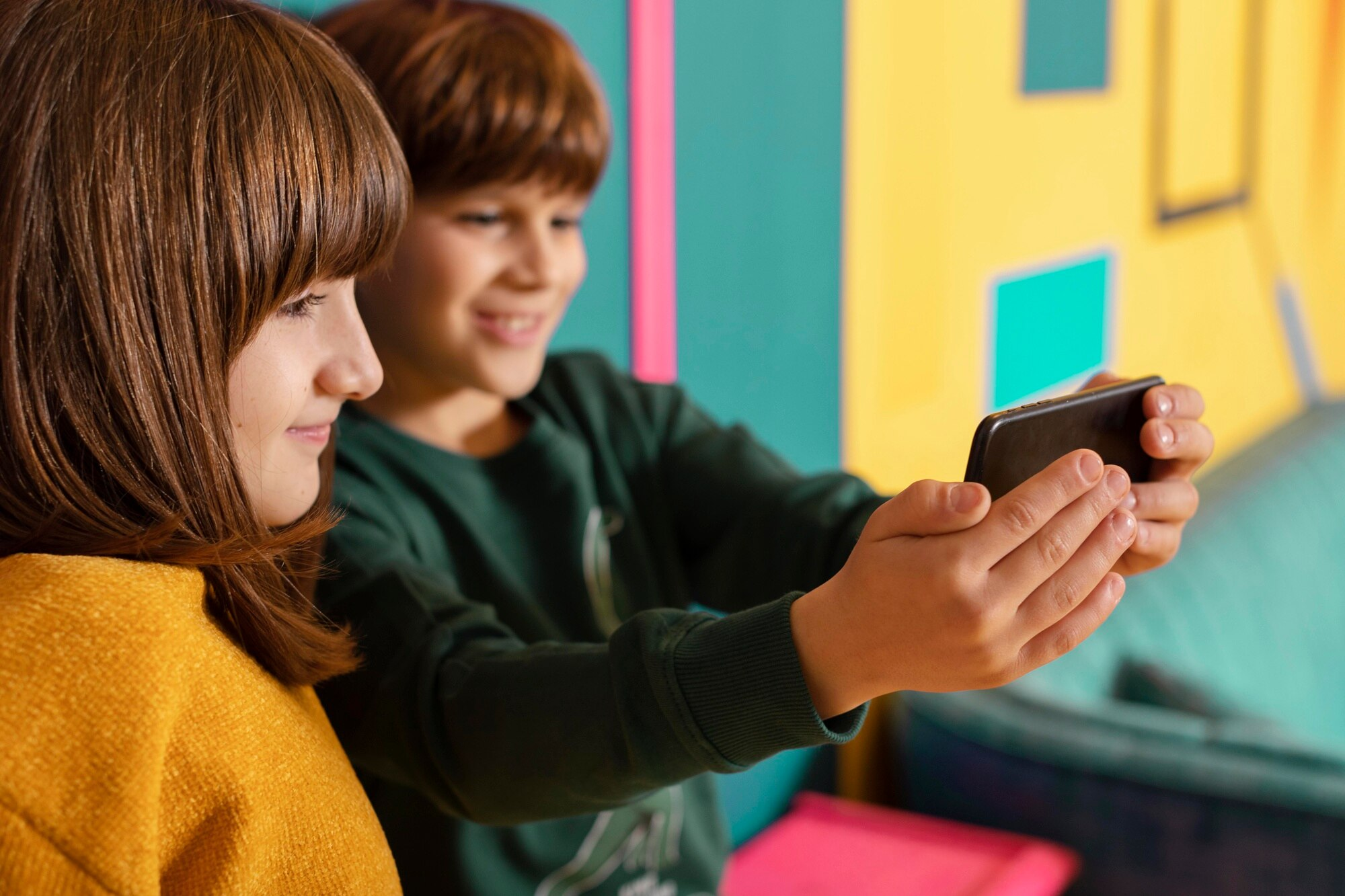 Two kids taking a selfie