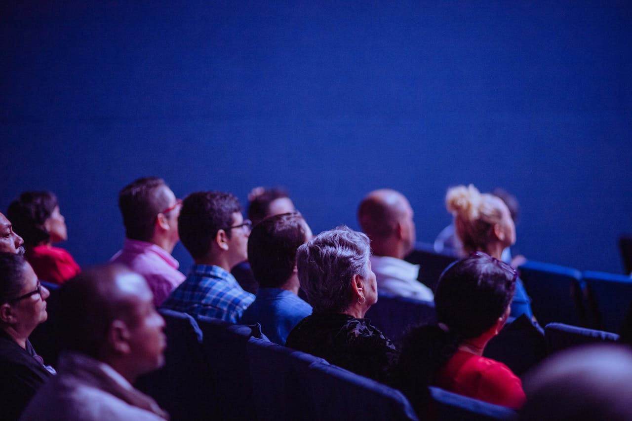 A group of people listening in a conference