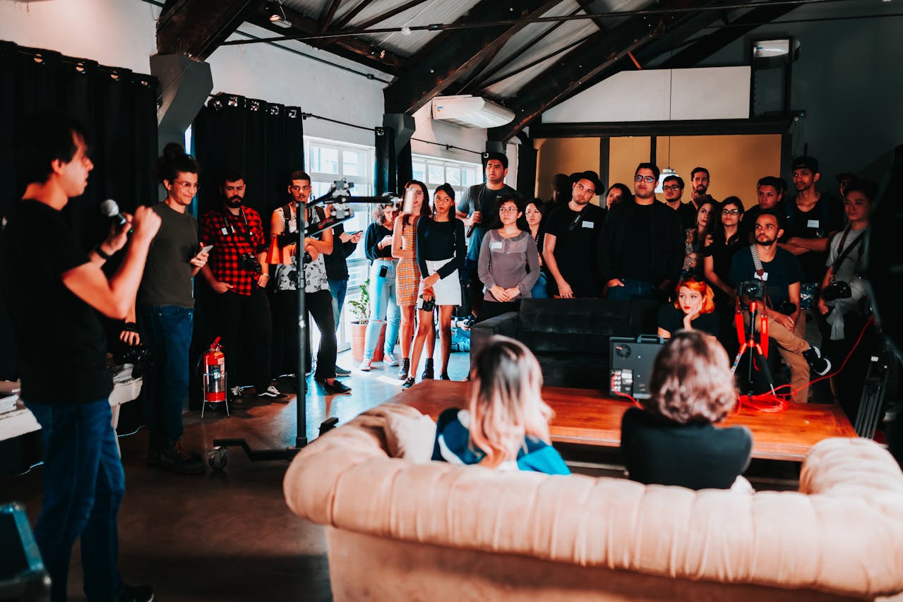 A group of people in a training session listening to a speaker